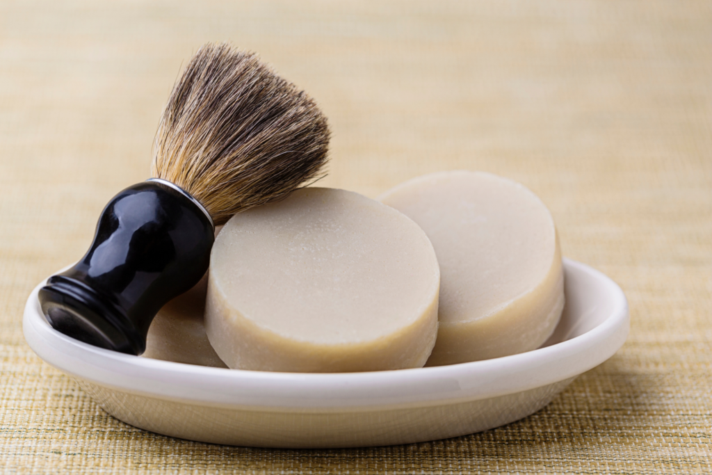 shaving soap in a dish with a shaving brush