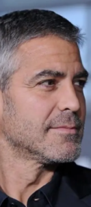 George Clooney with a dignified salt-and-pepper 5 o'clock shadow beard.