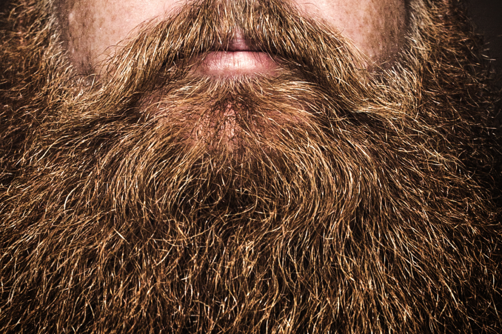 The natural beard style is characterized by a lack of intense grooming and styling.